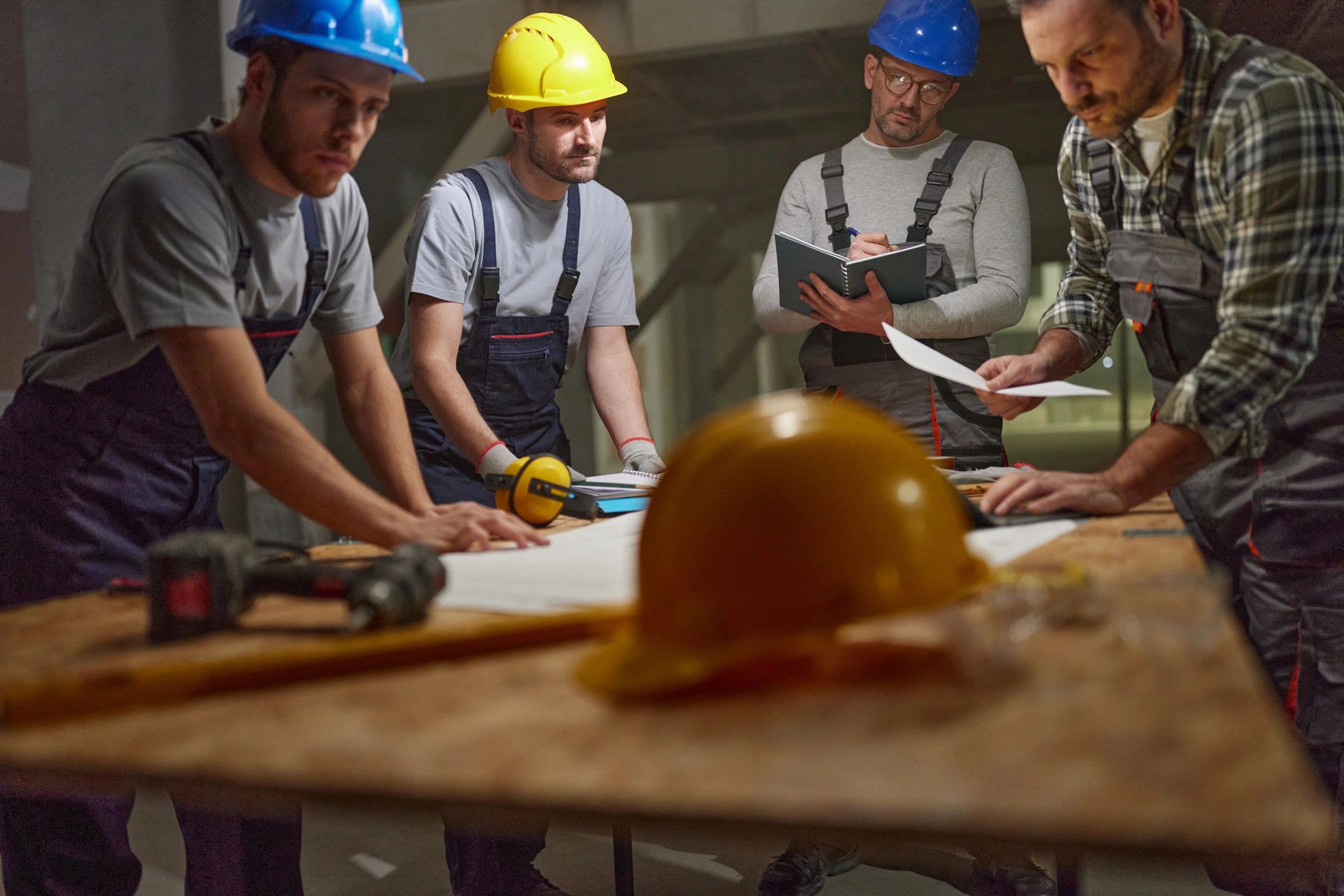 Engineering team reviewing plans on site